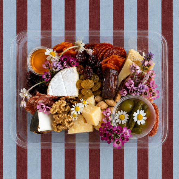 Lady & Larder cheese and charcuterie mini box on burgundy background